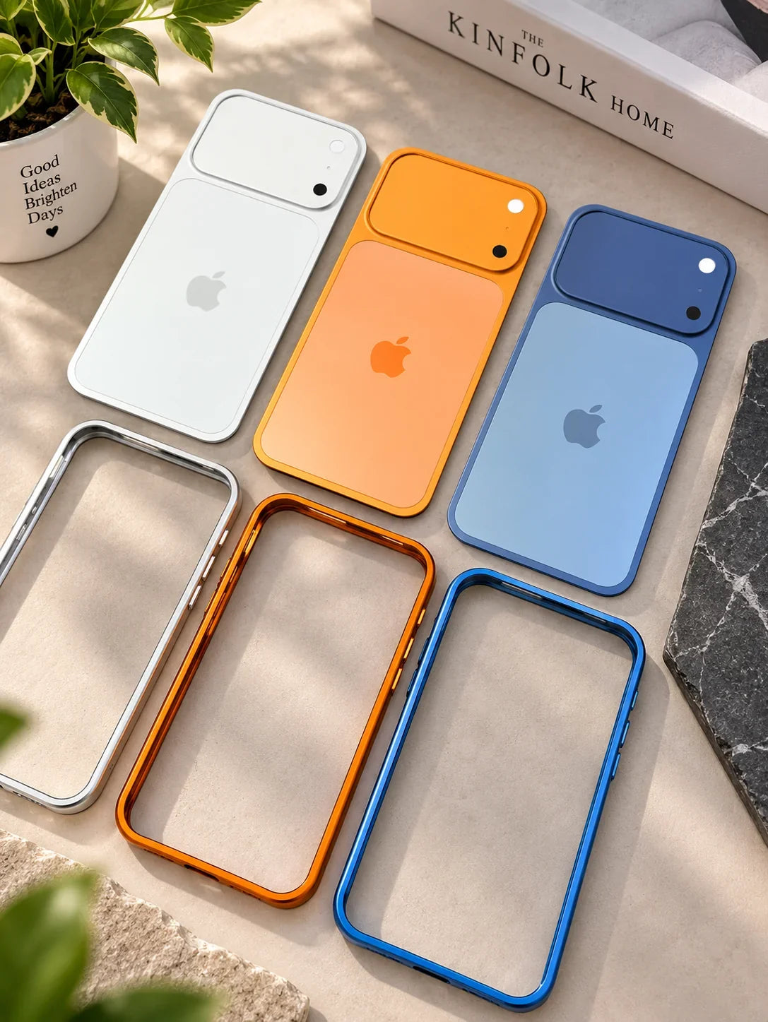 iPhone 16 converter cases in white, orange and blue laid flat
